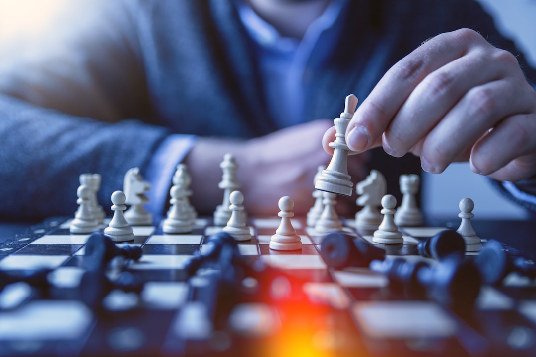 our-experience depth-of-field-photography-of-man-playing-chess-fzoitus1diq